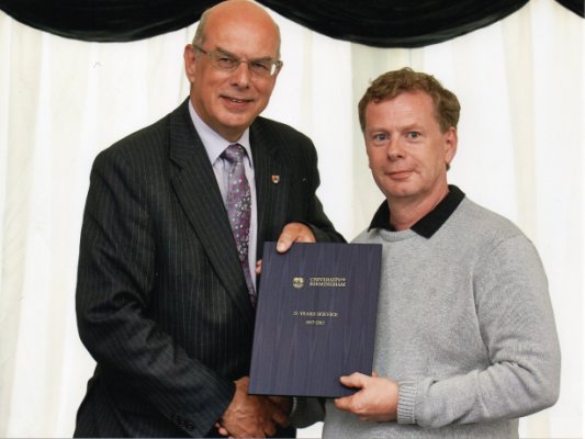 Alan Yates receiving 25 years long service award from the Vice Chancellor